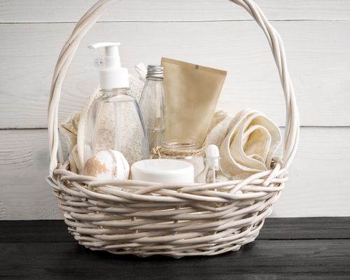 A white basket with toiletries and restroom necessities at a wedding.