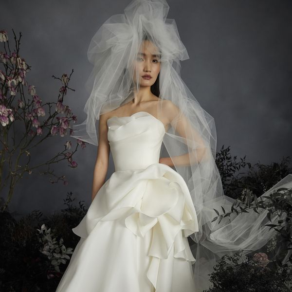bride wearing a full tulle veil and corset bodice wedding ball gown