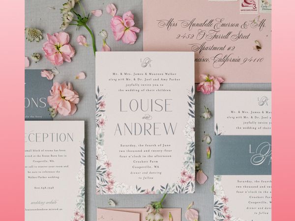 Summer wedding invitation suite with pink, white, and blue design with florals