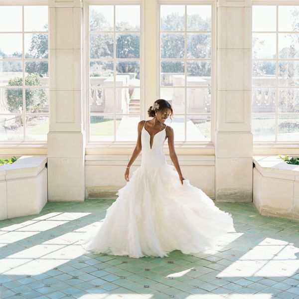 bride wearing a ruffle drop waist wedding dress