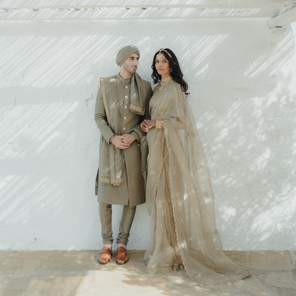 Portrait of Wedding Couple wearing traditional Indian wedding attire