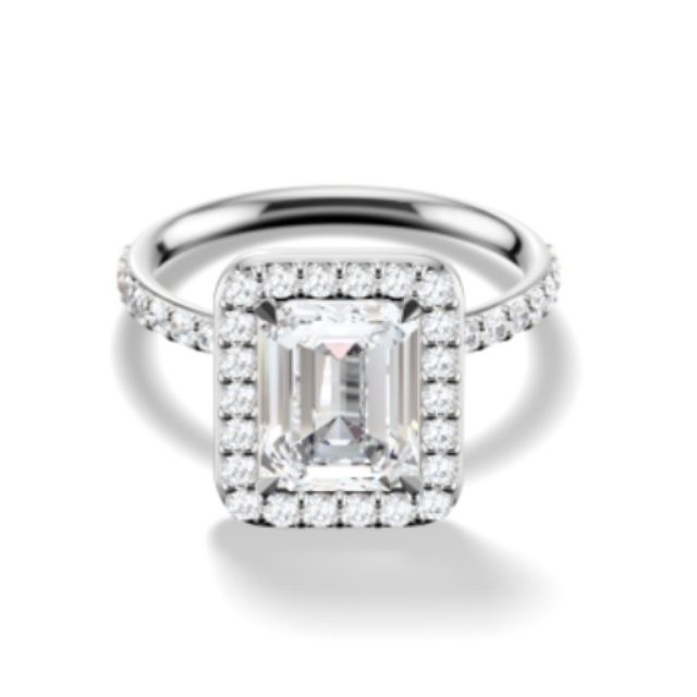 emerald cut diamond with a halo pavÃ© and silver metal