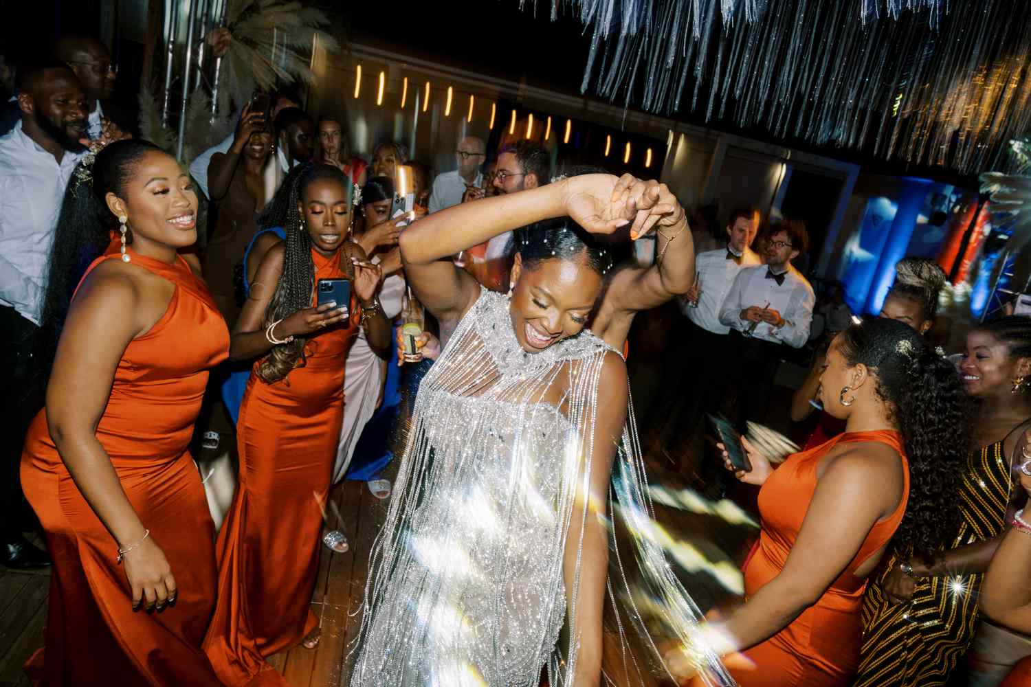 bride dances in glittering reception outfit