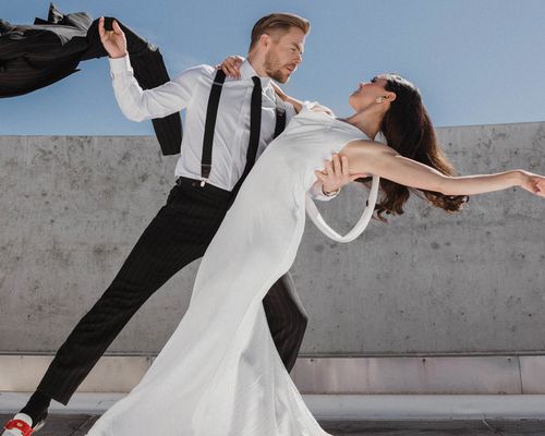 Derek Hough and Hayley Erbert in Formal Attire Dancing on Rooftop