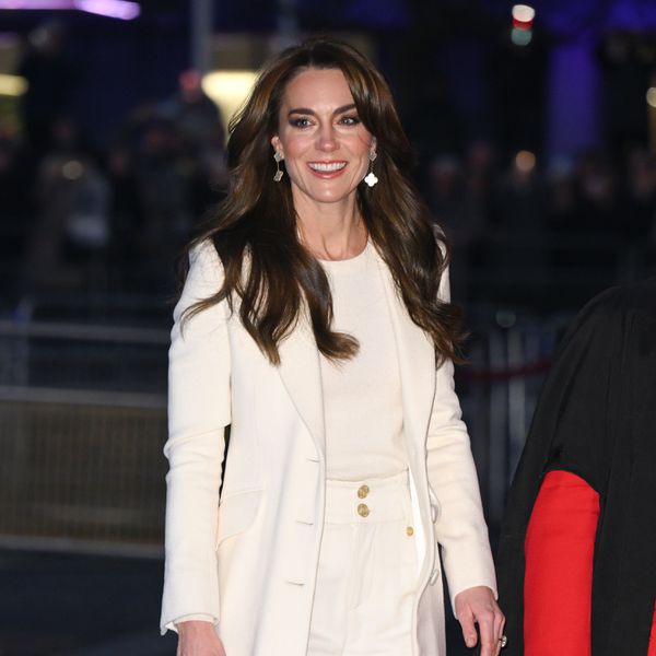 Kate Middleton in all-white outfit walking in the streets