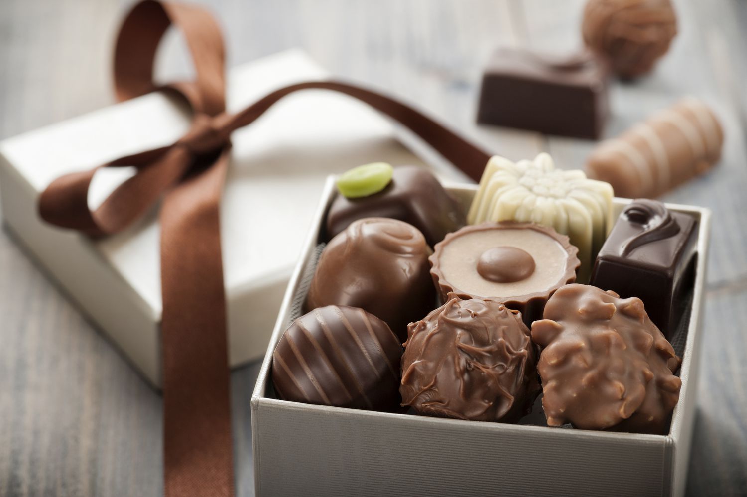 An opened box of assorted chocolate candies 