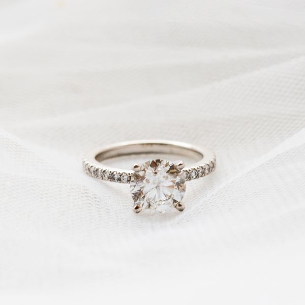 Beautiful diamond engagement ring on a white veil