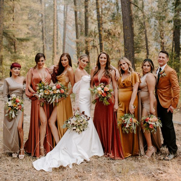 mixed-gender wedding party wearing jewel-tone colored outfits