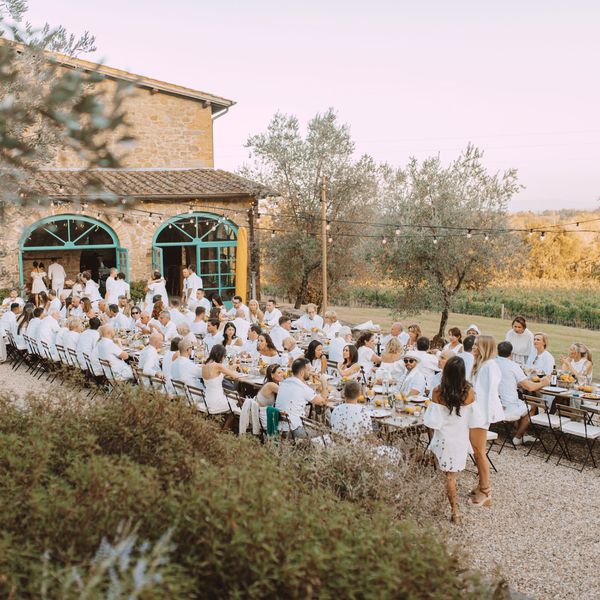 Wedding Guests Dressed in White During Wedding Welcome Party in Italy