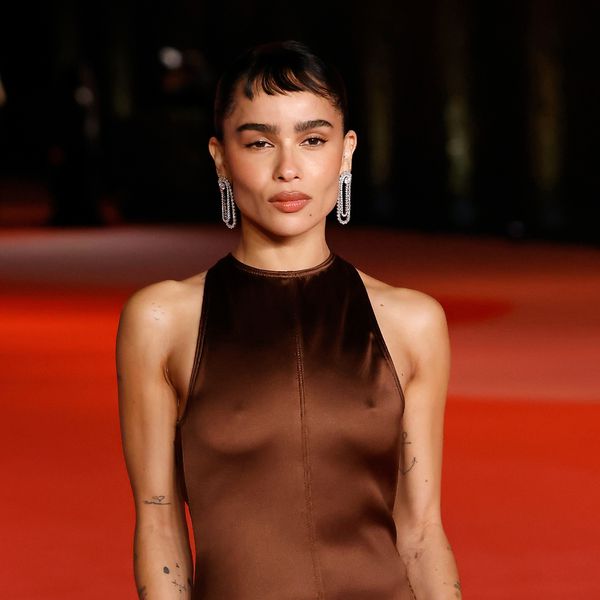 Zoe Kravitz posing in a brown satin dress for the third annual Academy Museum Gala on the red carpet