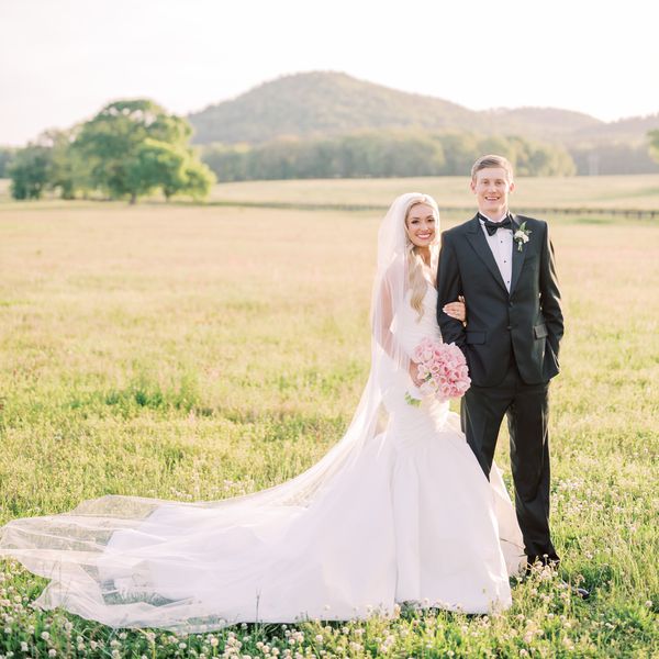 Portrait of Wedding Couple in field