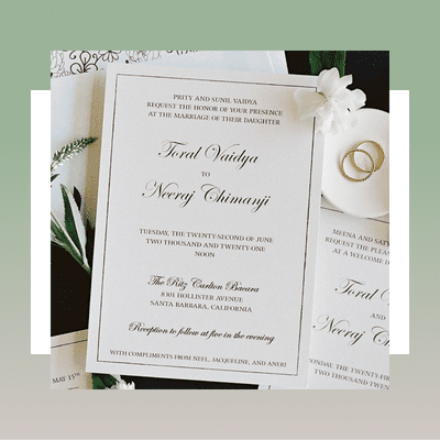 white elegant wedding invitation with black calligraphy and font