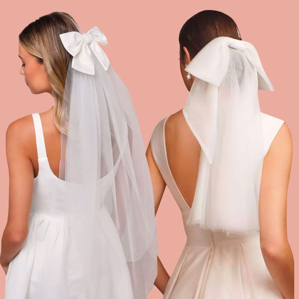 Two models wearing veils with bows
