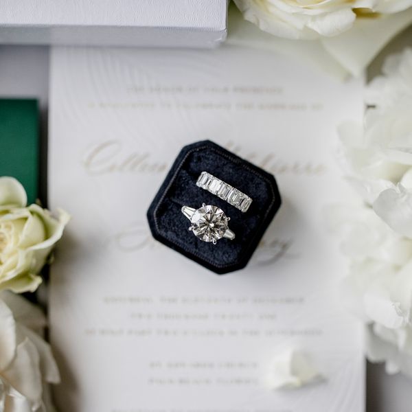 a diamond engagement ring and wedding band in a ring box