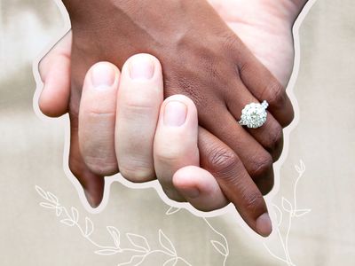 Two hands held together showcasing a round cut engagement ring