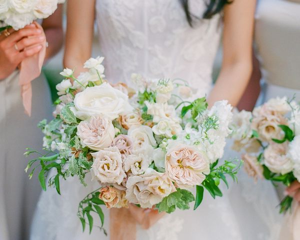 Loose, Romantic Pink and White Wedding Bouquet of Roses, Lisianthus, Sweet Peas, and Greenery