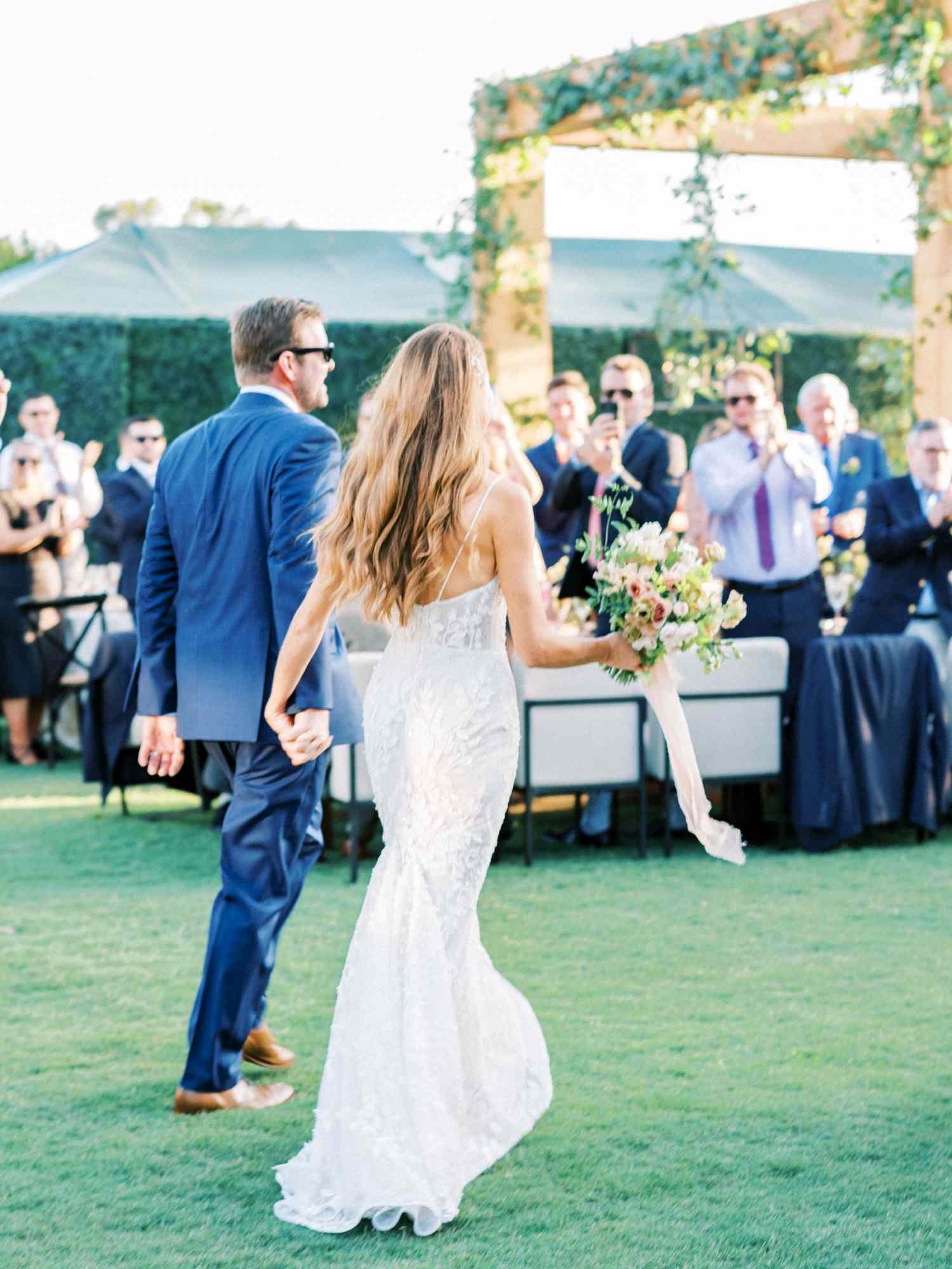 bride and groom enter reception