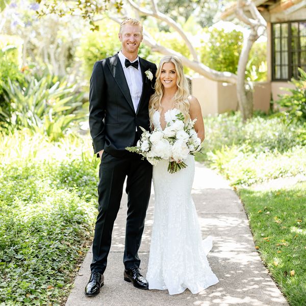 Olympic Volley Ball Player Chase Budinger in Tuxedo and Wife in Wedding Dress With White Bouquet Pose for Wedding Portrait