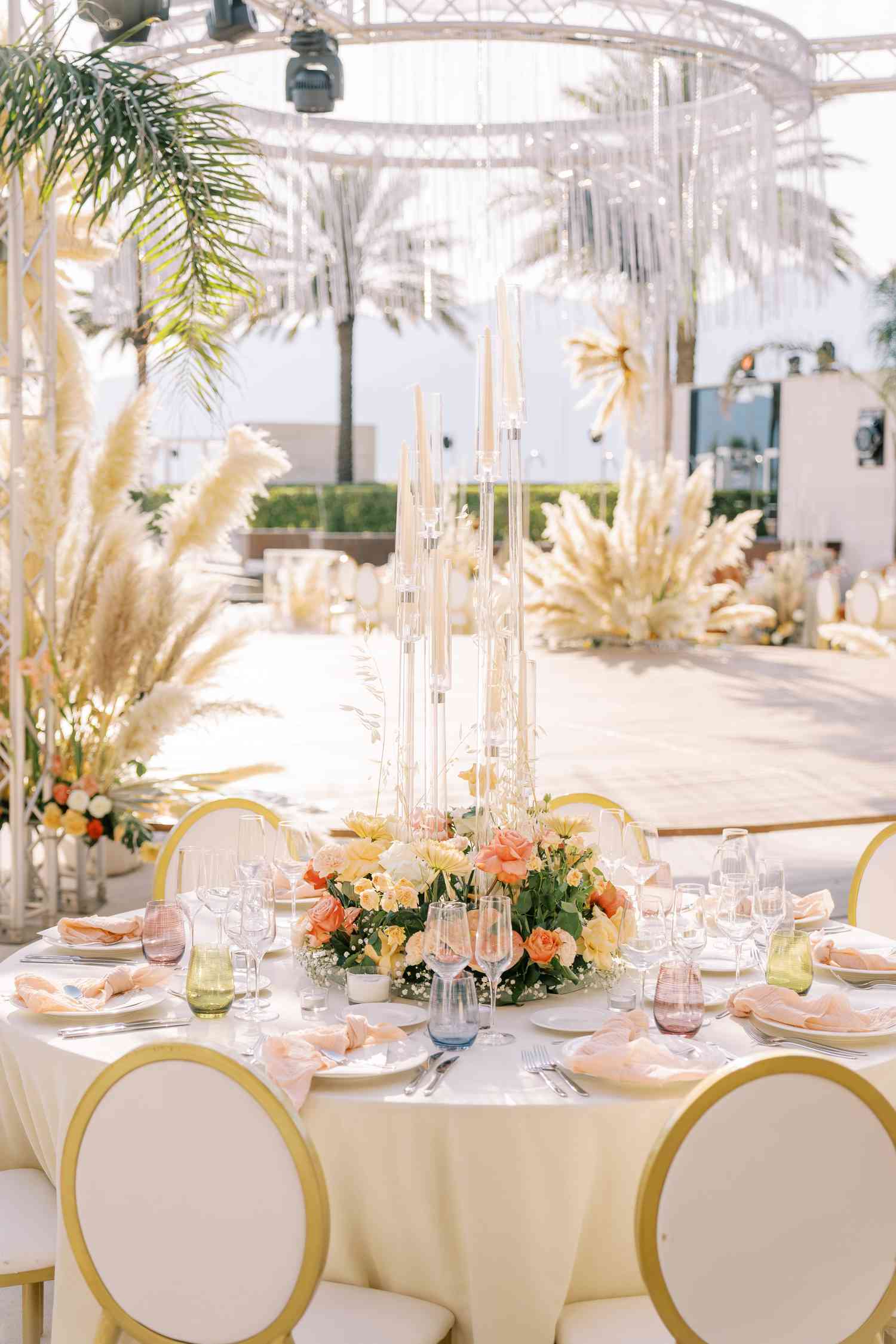 pampas grass and orange florals at reception