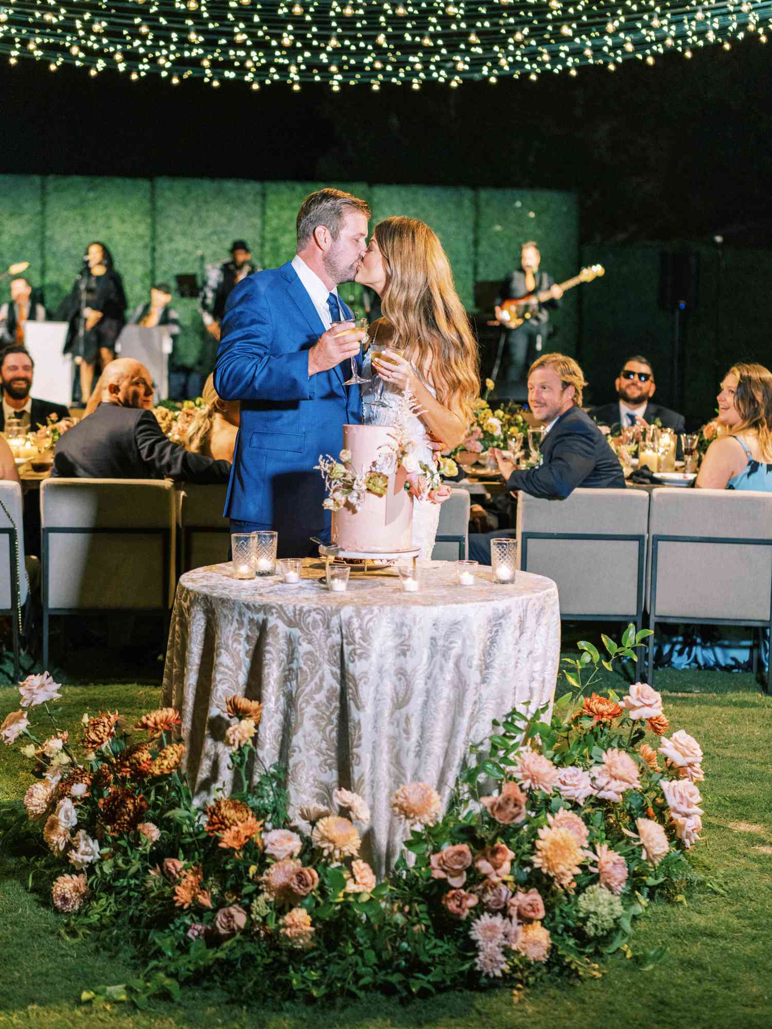 bride and groom cut the cake