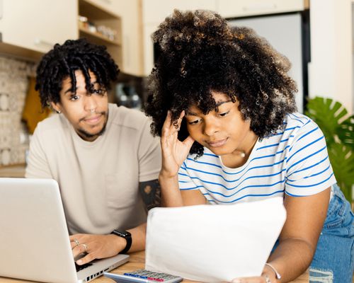 Stressed young couple is managing their household tasks