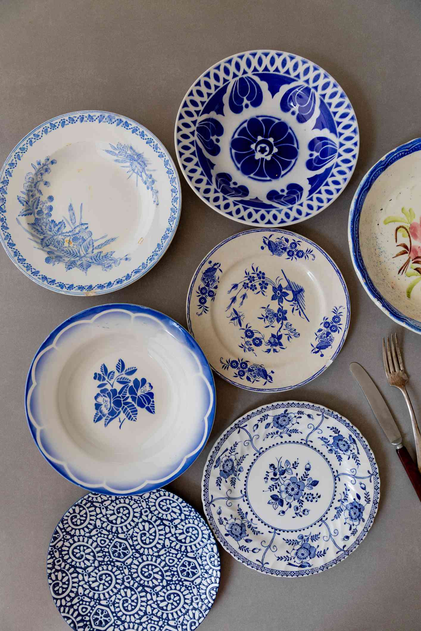 high angle view of chinoiserie plates in blue and white pattern on a table 