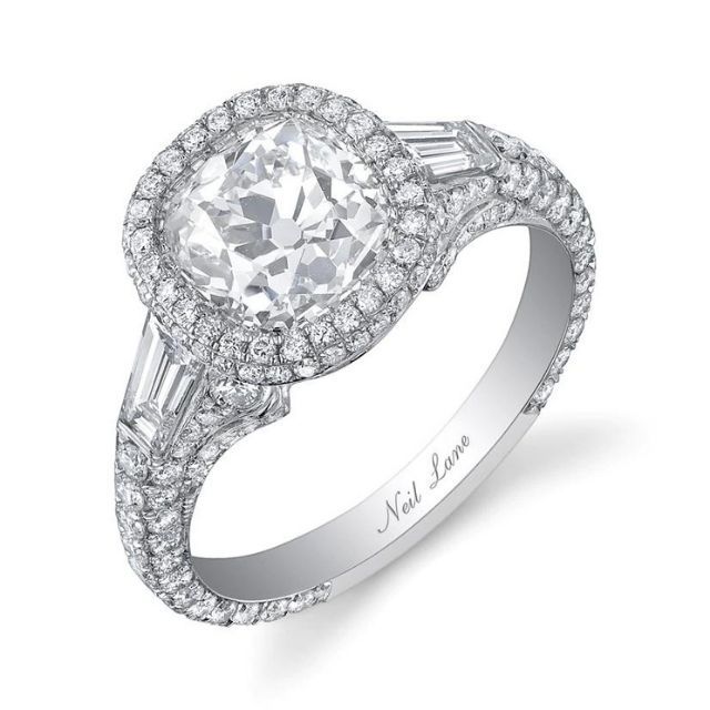 cushion-cut platinum diamond engagement ring featuring two baguette diamonds