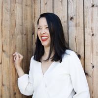 Woman smiling wearing red lipstick