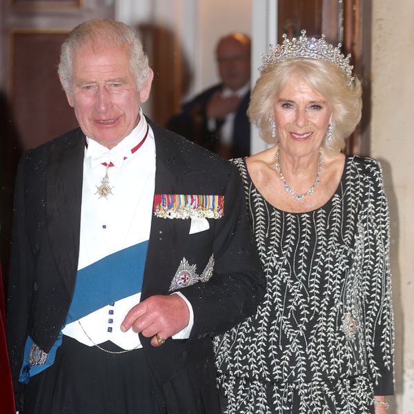 Queen Camilla and King Charles Linking Arms With One Another