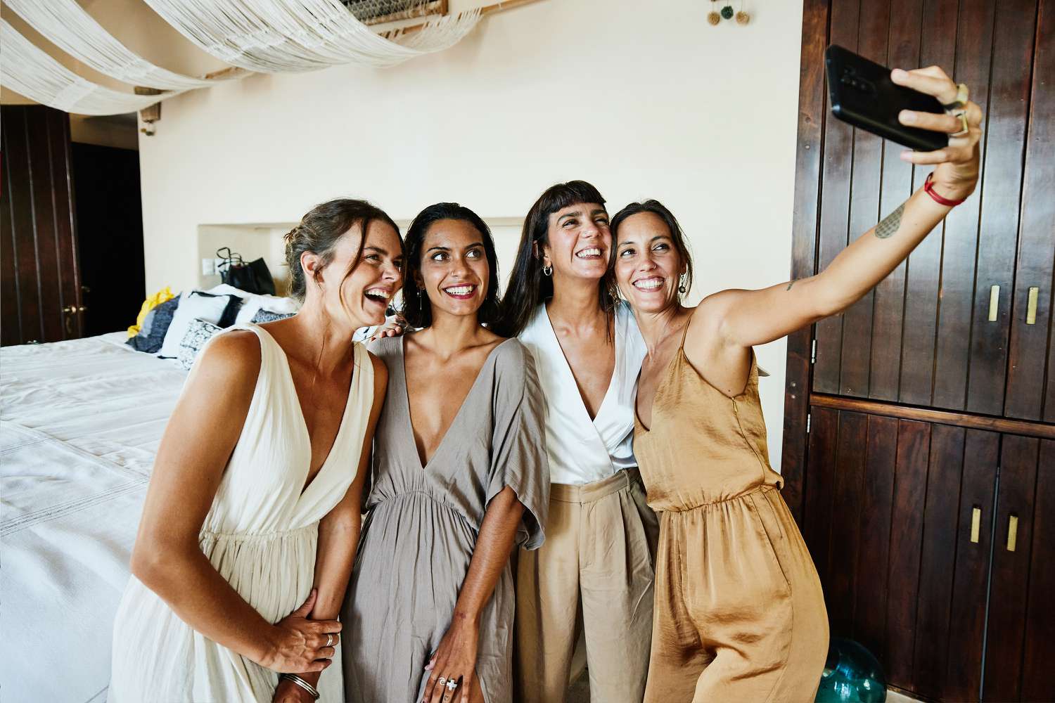 Women Taking Selfie in Hotel Room