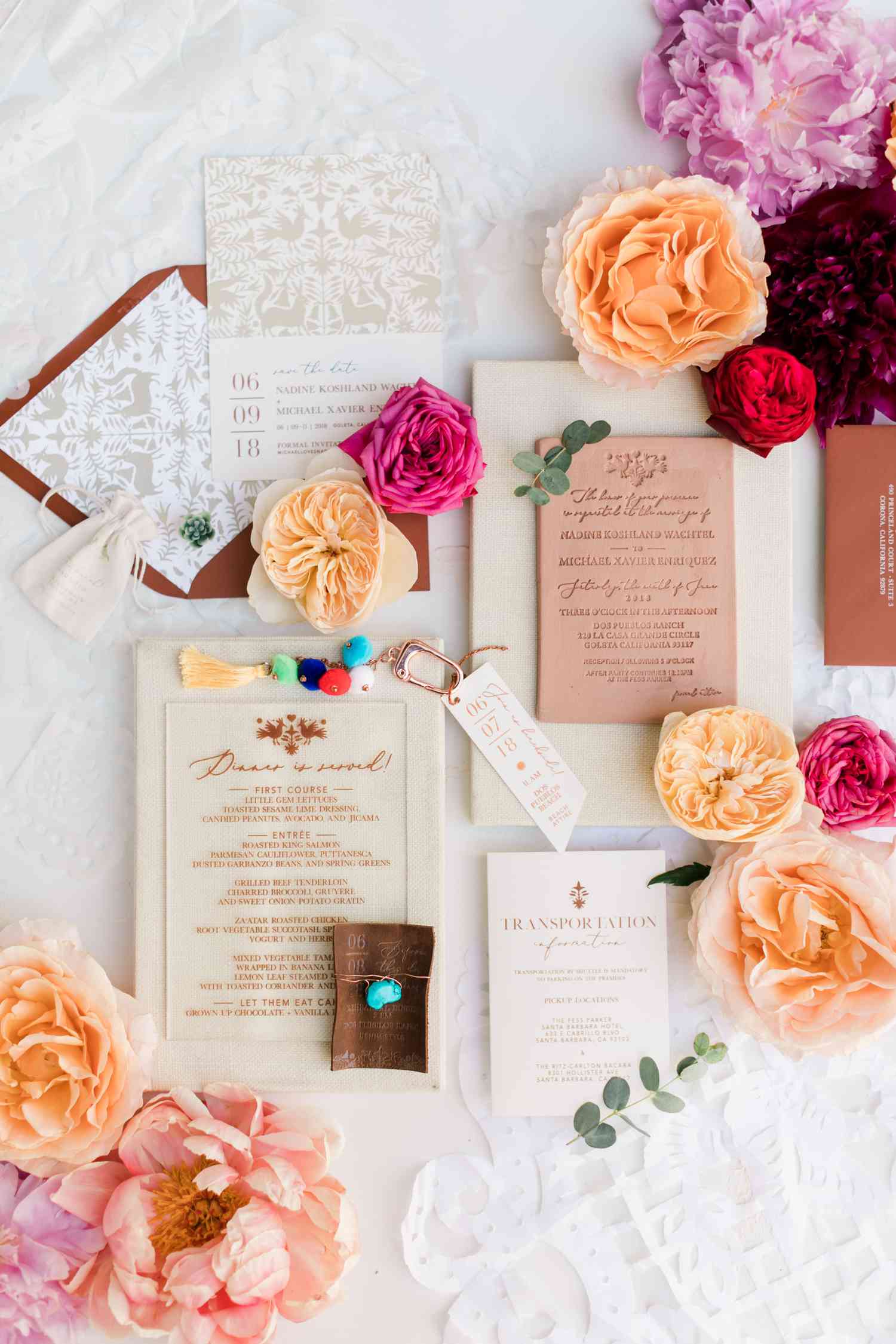 A terracotta boxed wedding invitation featuring fresh flowers.