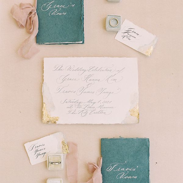 flat lay of a handwritten invitation suite