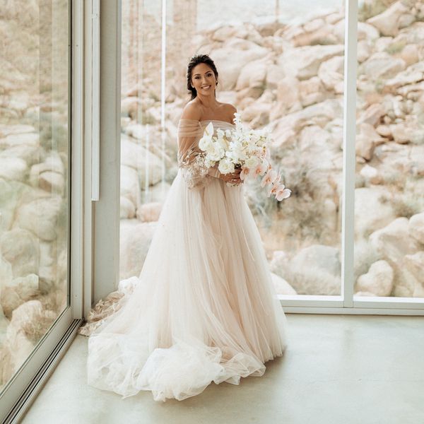 bride wearing a tulle wedding dress with a desert backdrop