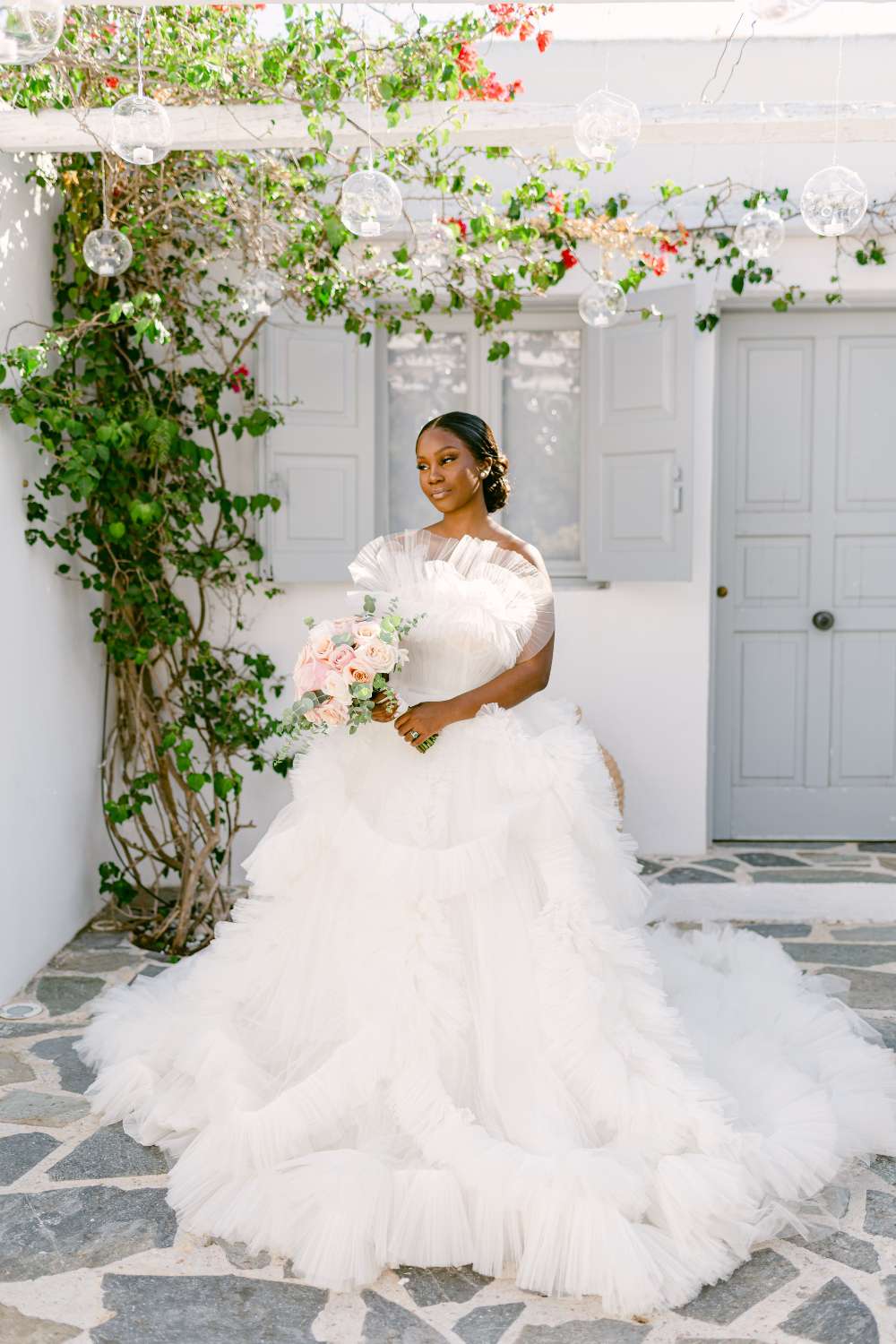 bride wearing a strapless tulle ruffled wedding dress