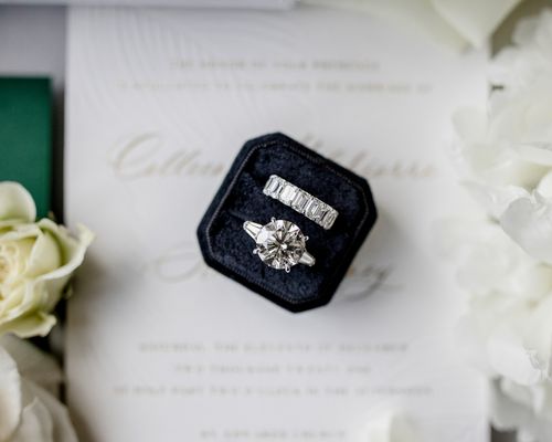 a diamond engagement ring and wedding band in a ring box