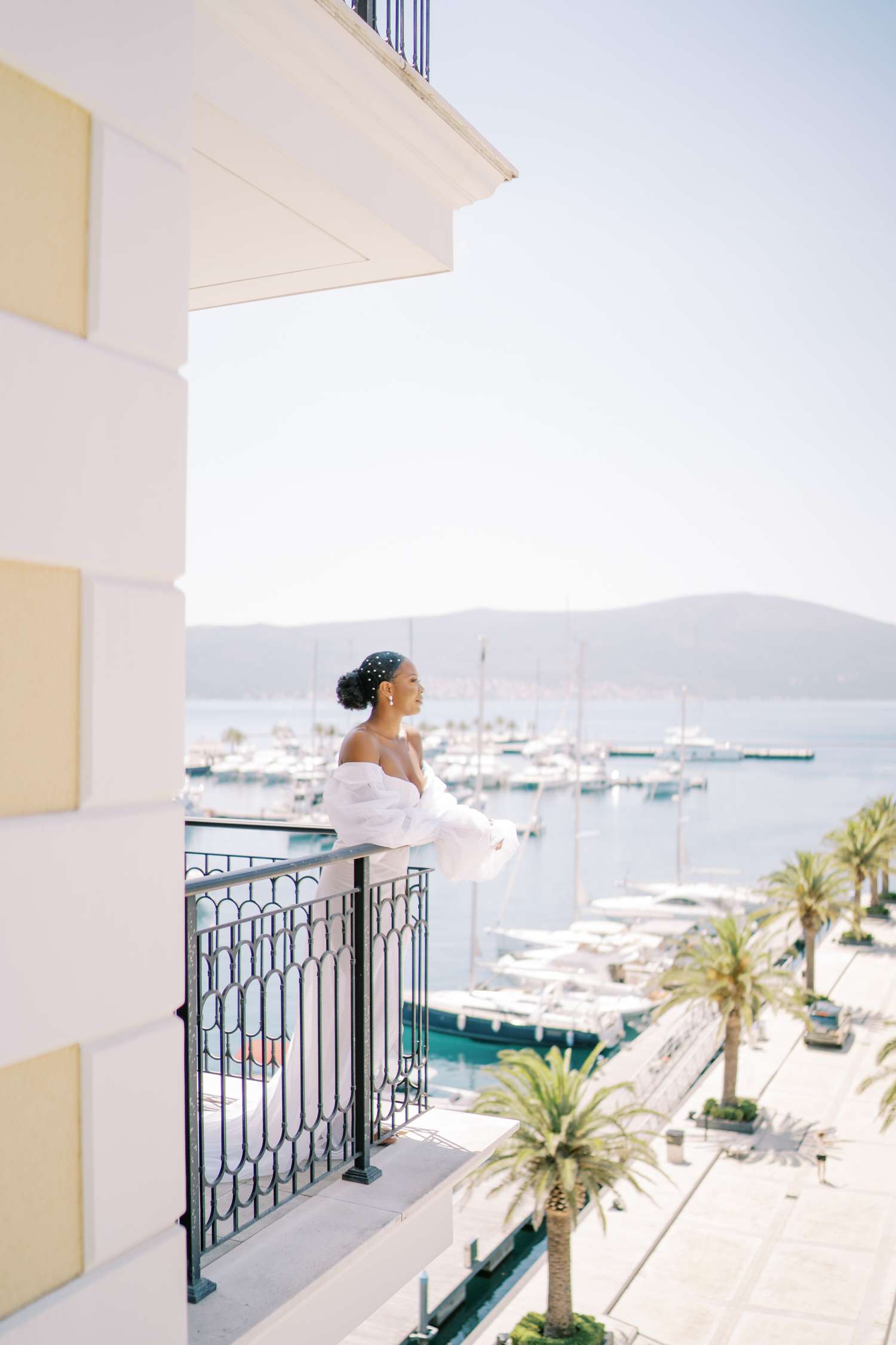 bride looks out on the water