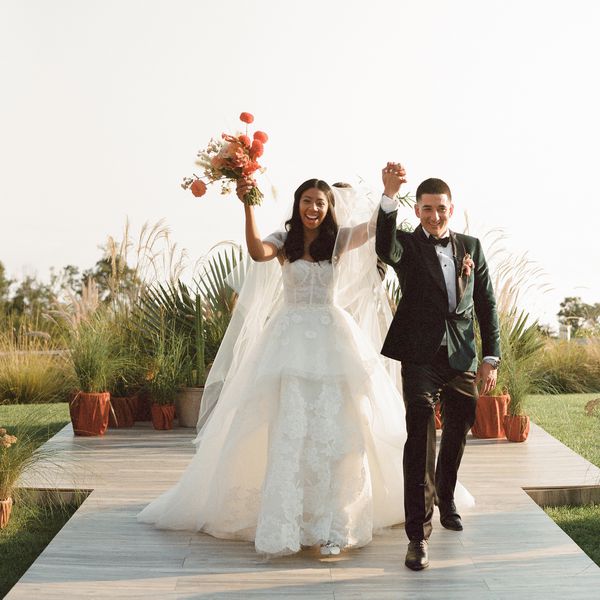 Bride and groom holding hands during the recessional