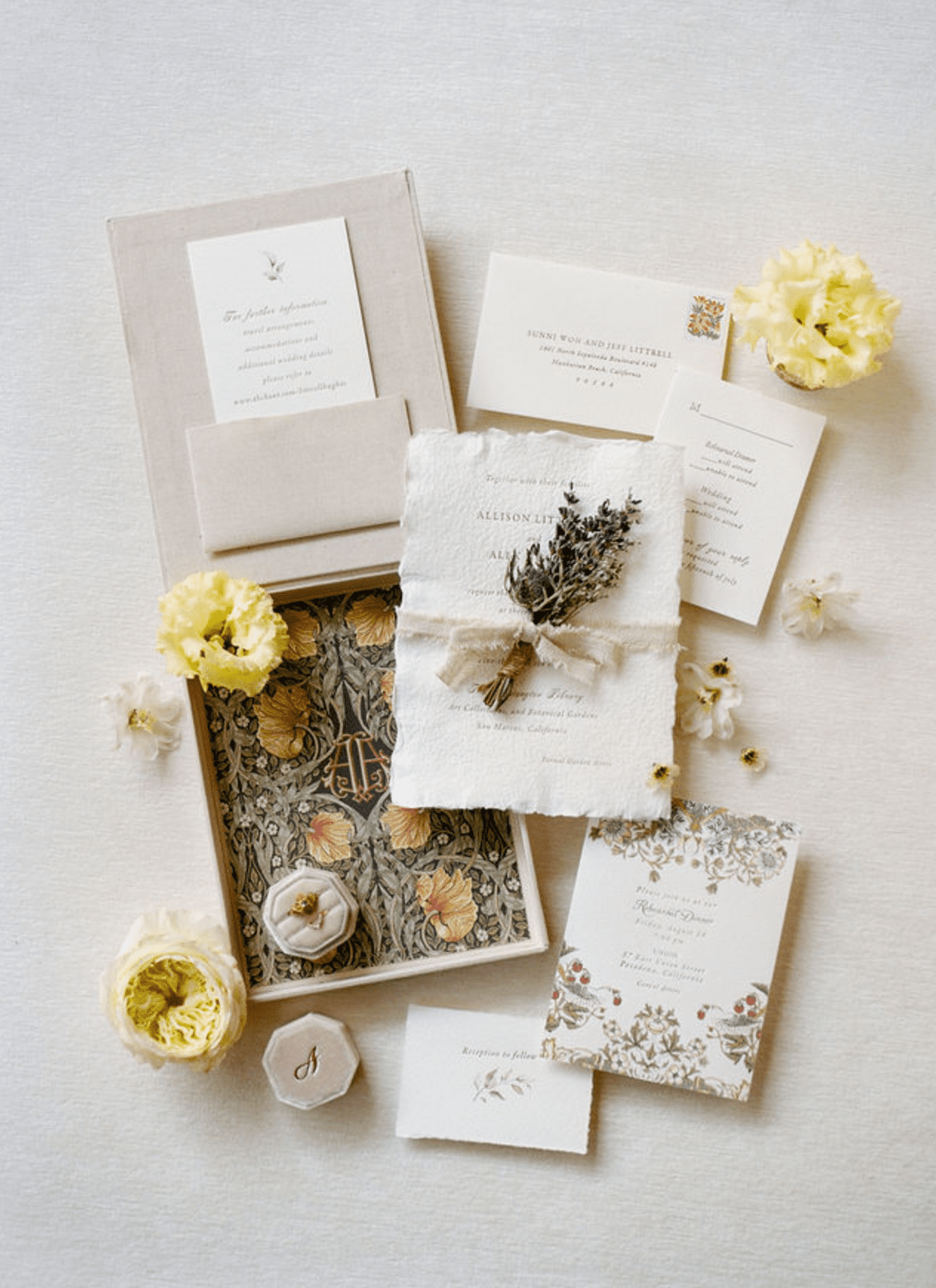  A ruffled-edge boxed wedding invitation.