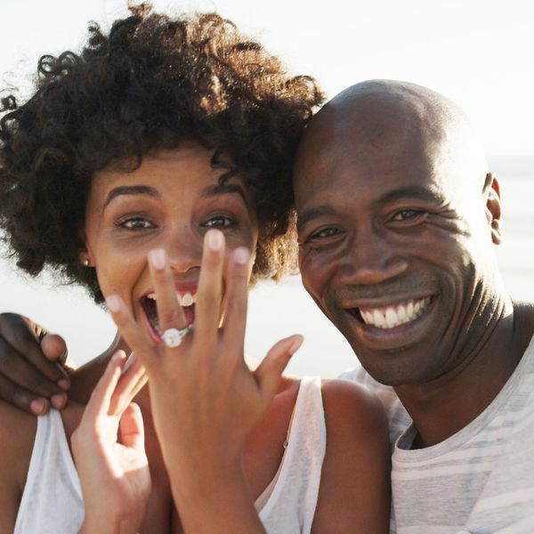 Happy couple shows off engagement ring after proposal