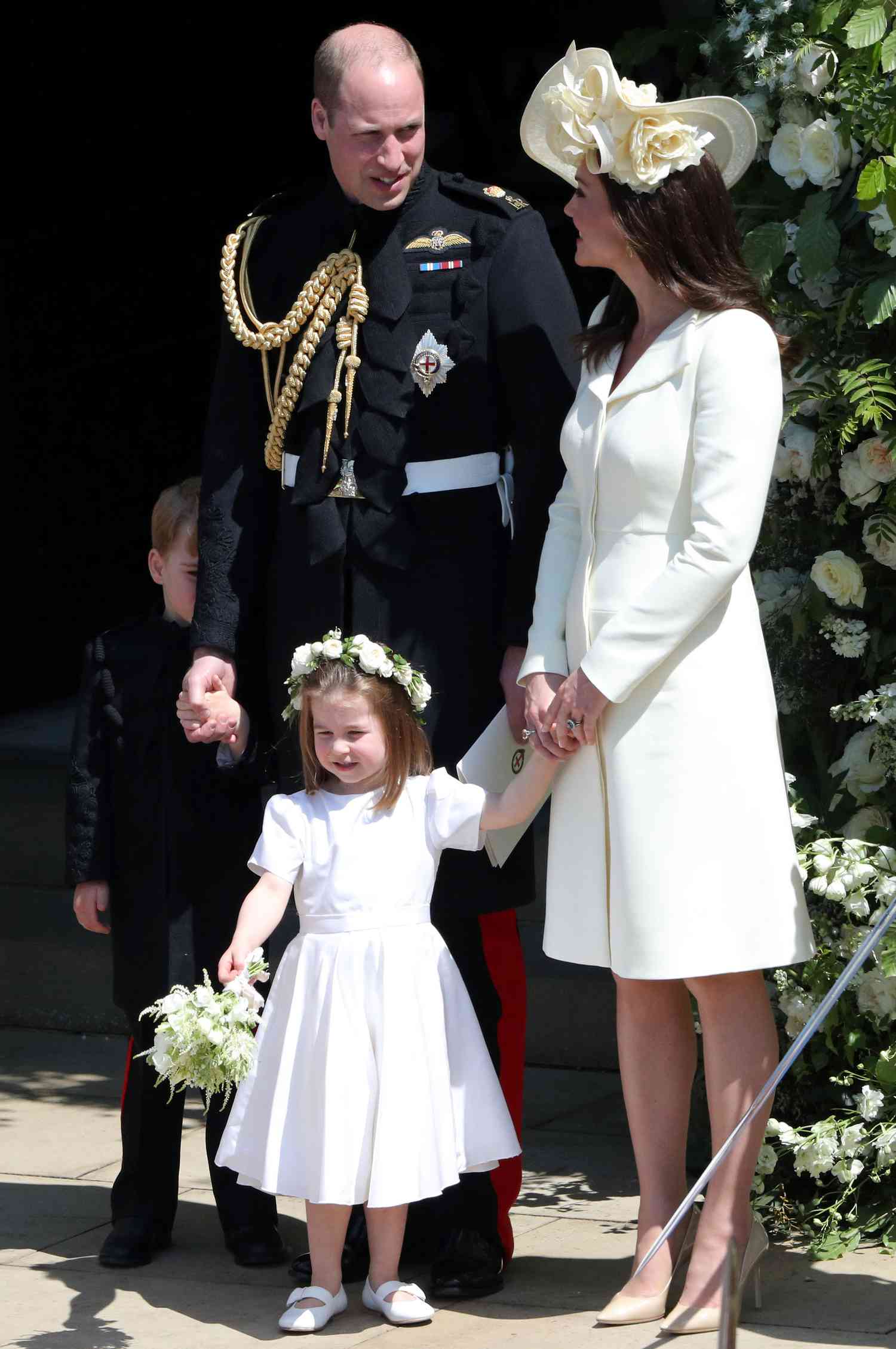Prince William and Kate Middleton with George and Charlotte at Prince Harry's Wedding