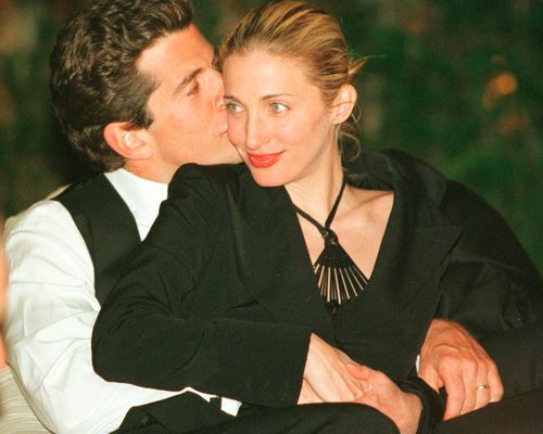 John F. Kennedy, Jr. Gives Wife Carolyn Bessette-Kennedy a Kiss on the Cheek