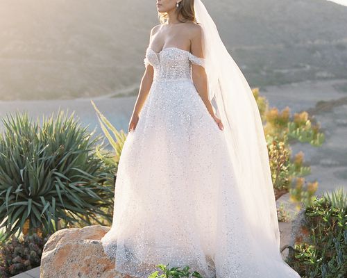 bride wearing an off-the-shoulder wedding dress