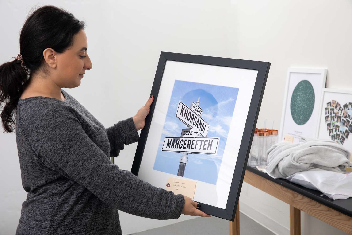 A person holds the Patricia Carlin Intersection of Love Photo Print. 