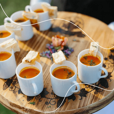 Fall wedding appetizer of tomato soup mugs