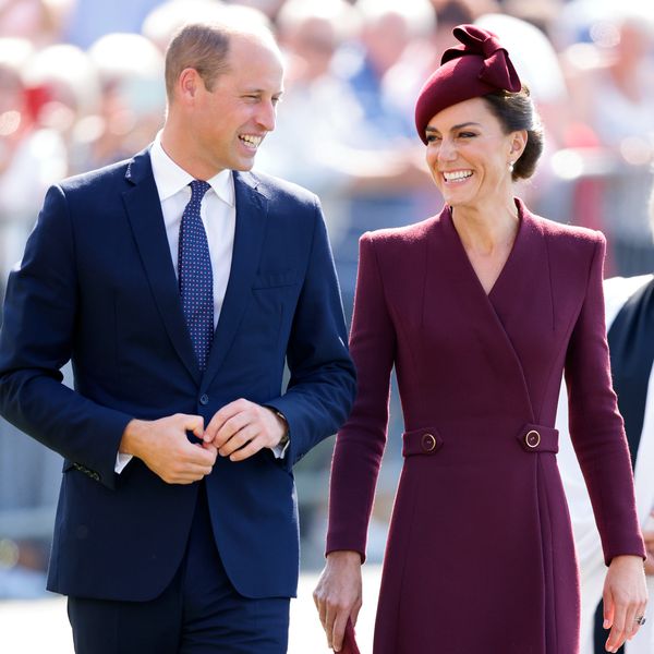 Kate Middleton and Prince William smiling at one another at St. Davids in Wales