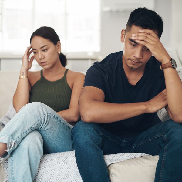 couple sitting on couch after an argument