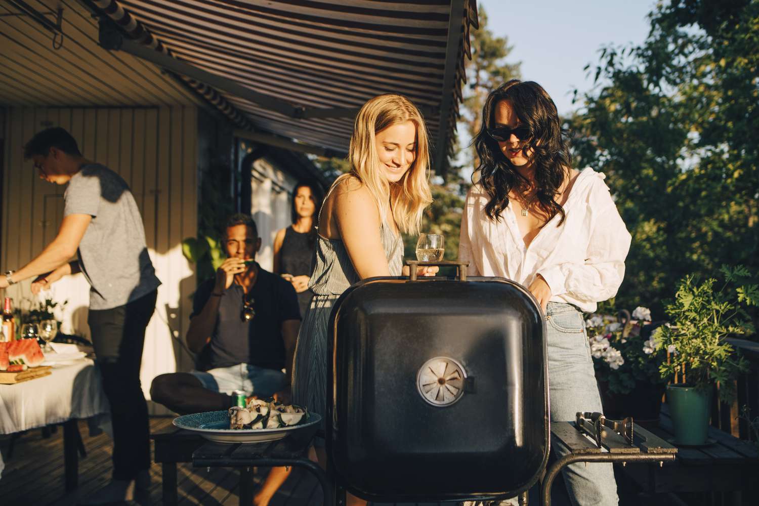 Friends grilling at a barbecue