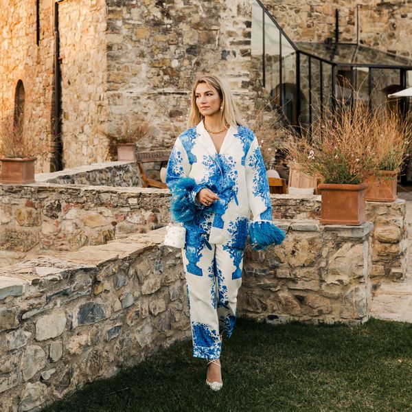 bride wearing a white and blue two-piece set