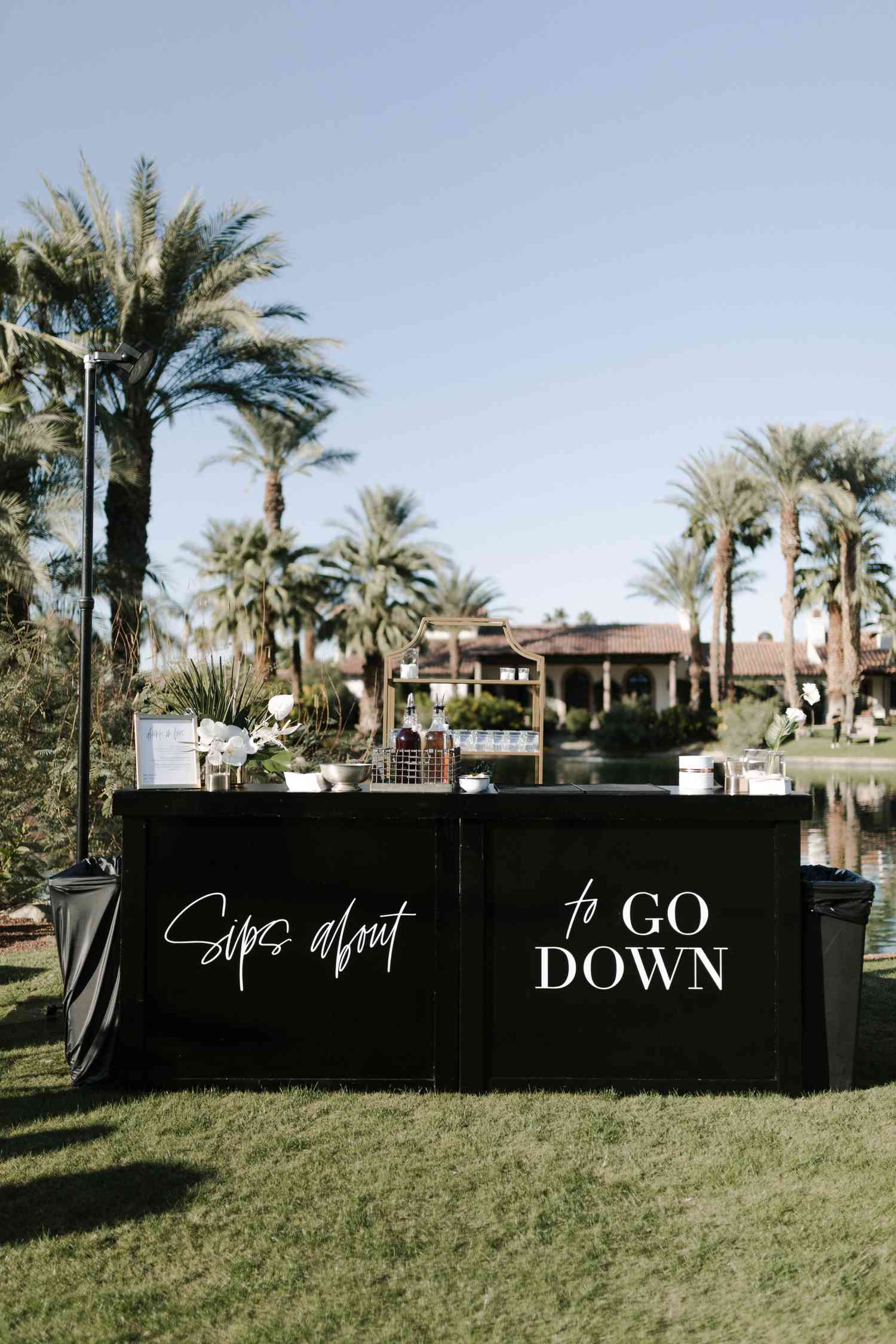 Black and white wedding bar with "Sips about to GO DOWN" text