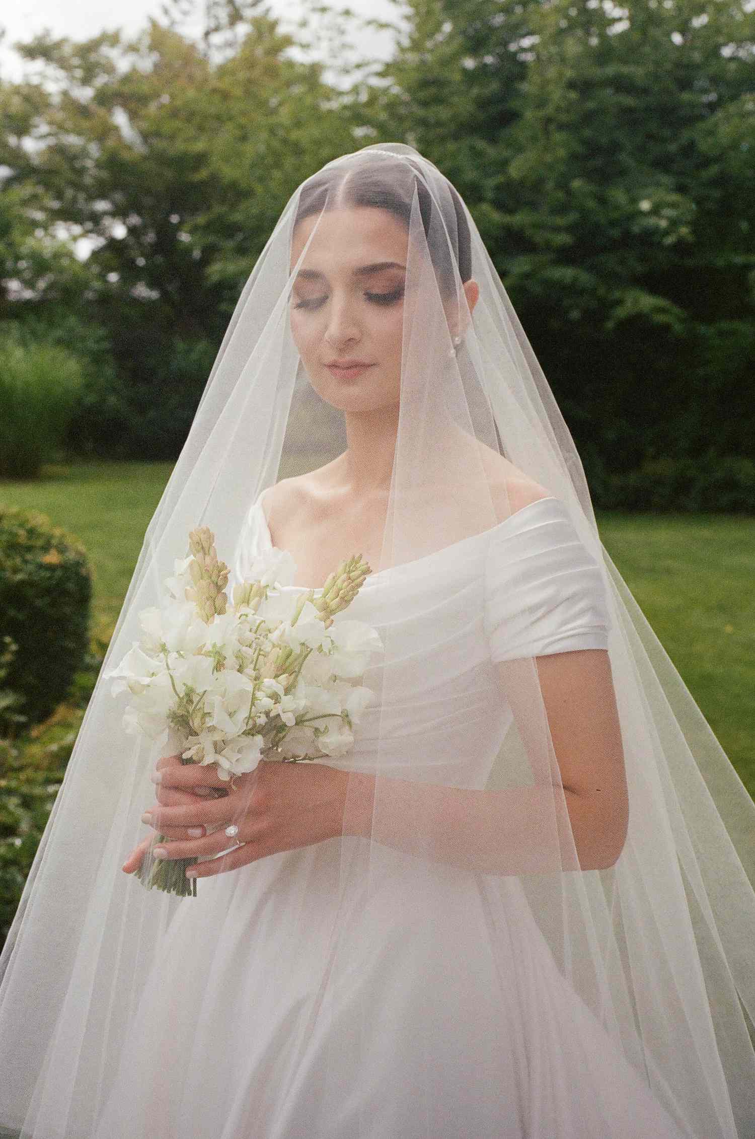 still shot of bride wearing a tulle veil 